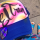 Airbrushed hats: Good and helpful. Santa costumes: Annoying and douchey